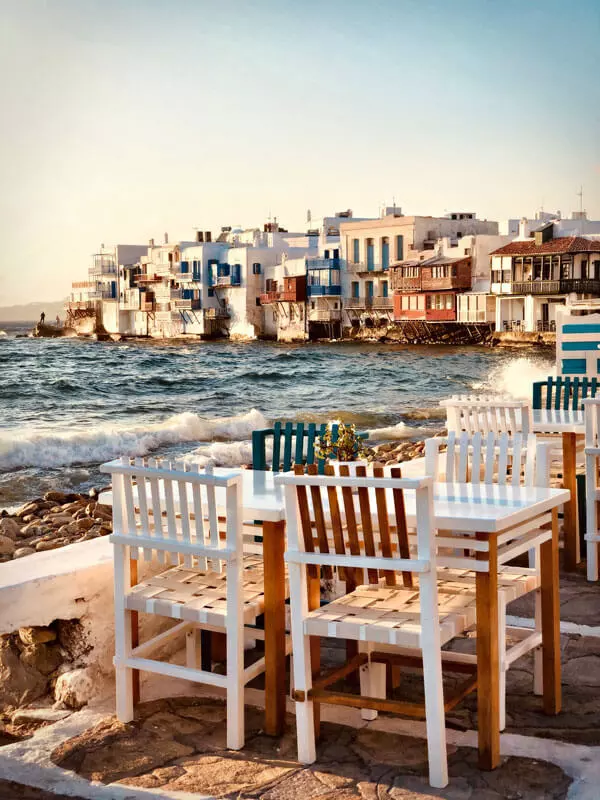 Table-right-next-by-the-water-with-view-of-a-settlement