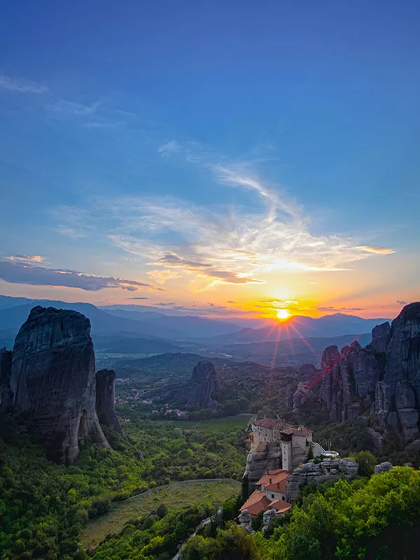 sunset-at-meteora-with-clear-blue-sky